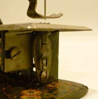 Toy sewing machine in original box circa 1900  