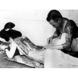  An Unidentified Japanese Tattoo Artist Works on a Womans 