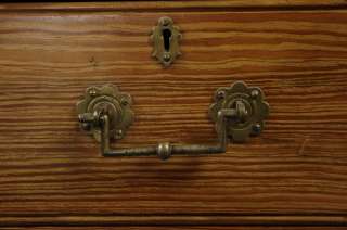 Solid brass hardware contrasts wonderfully with the rustic pine.