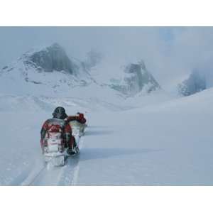  Climbers Travel over Baffin Island Via Snowmobile Towed 